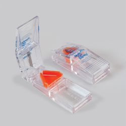 Coupeur de comprimés transparent avec compartiment de stockage